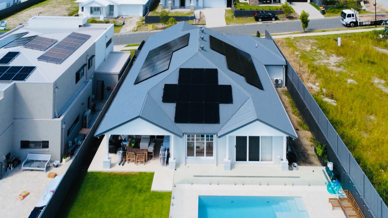 Rooftop solar installation beside a pool
